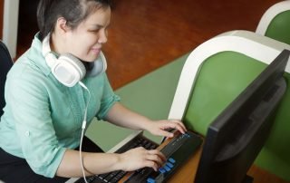 Woman using braille keyboard