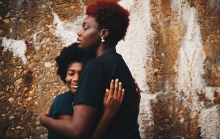 Photo of mother and daughter by Eye For Ebony on Unsplash