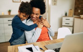 Mom and son hugging and happy
