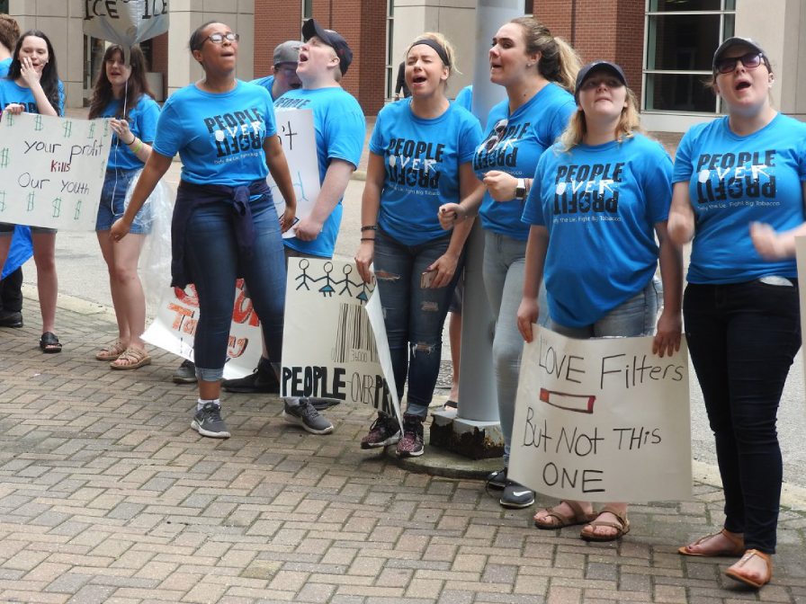 Youth chanting at rally outside Altria meeting