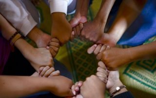 Holding hands in a circle