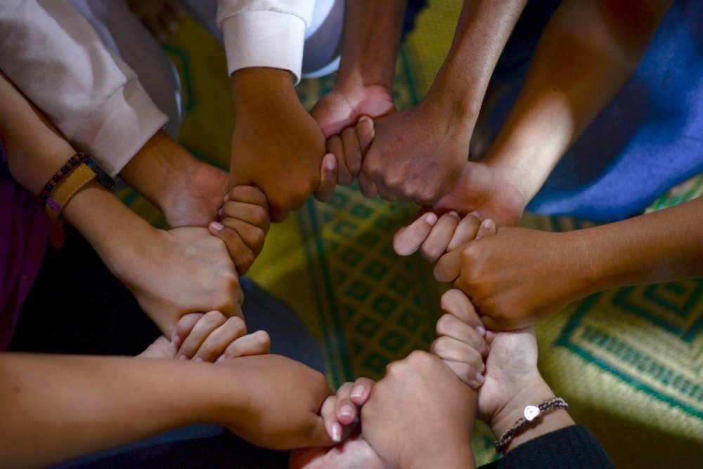 Holding hands in a circle