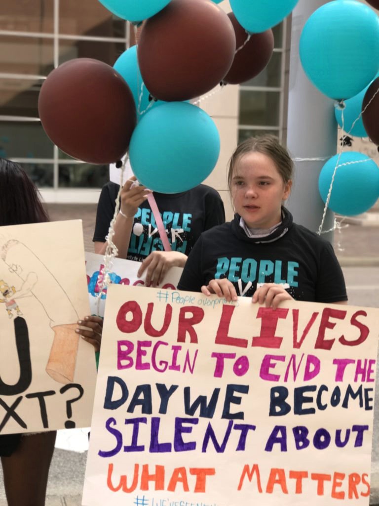 Youth with protest sign